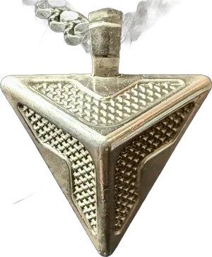 The Triangle Pendant isolated against a deep red glow